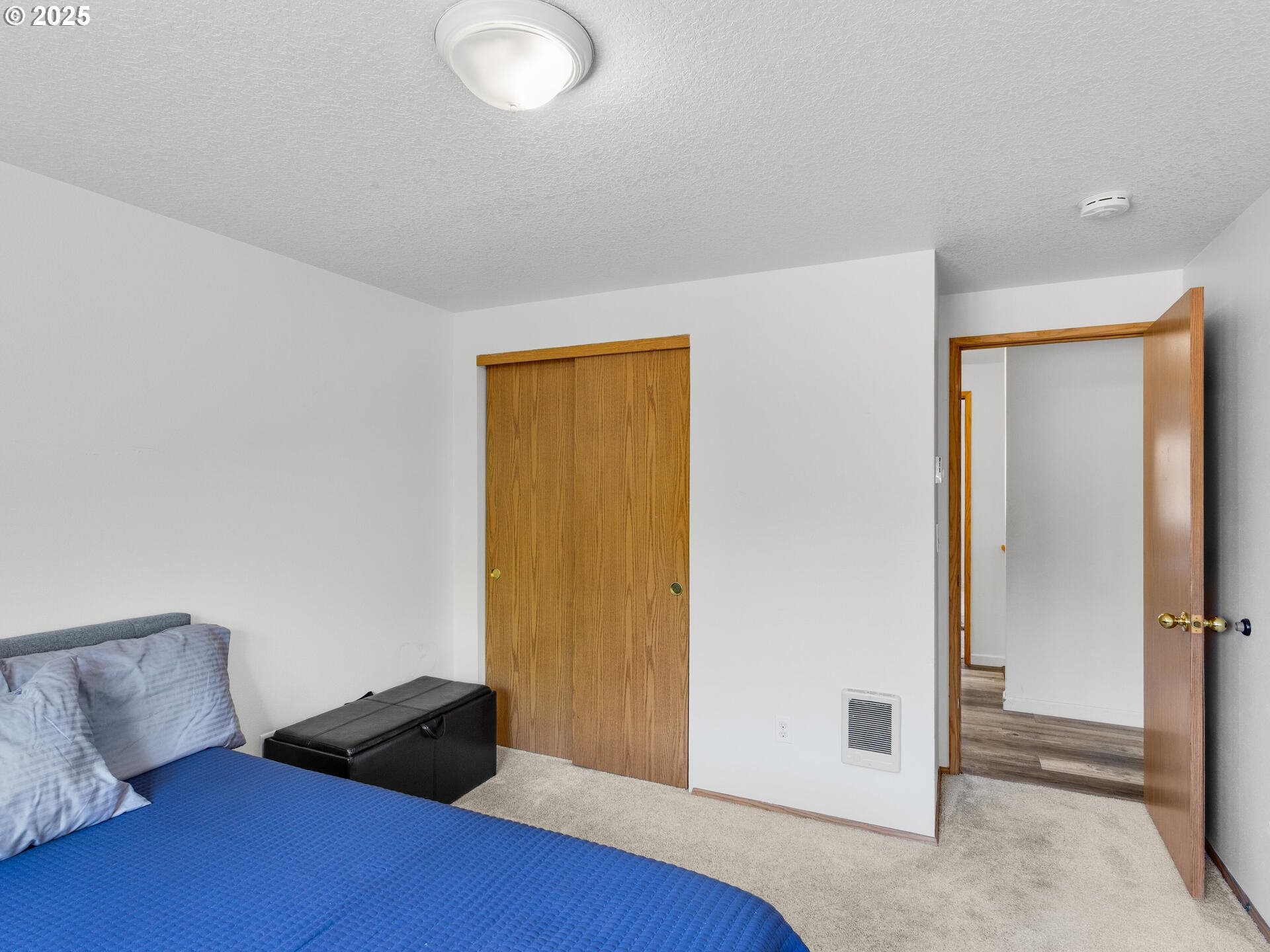 8292 Northeast Snowberry Loop Vancouver, WA 98664 - Photo 37 of 48 a bedroom with a bed and a dresser