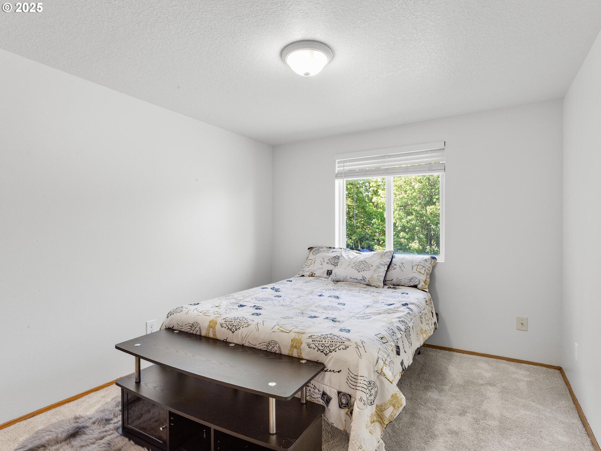 8292 Northeast Snowberry Loop Vancouver, WA 98664 - Photo 38 of 48 a bedroom with a bed and a window