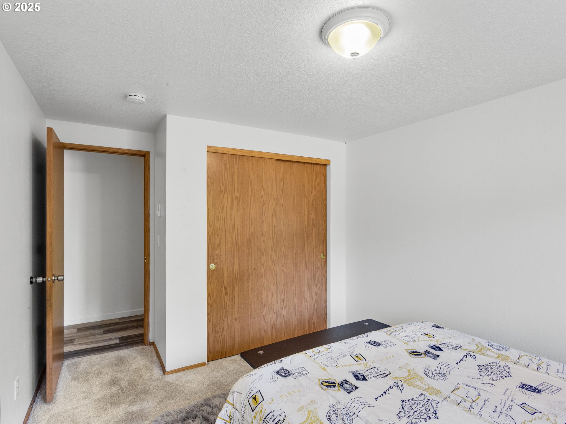 8292 Northeast Snowberry Loop Vancouver, WA 98664 - Photo 39 of 48 a bedroom with a bed and a window