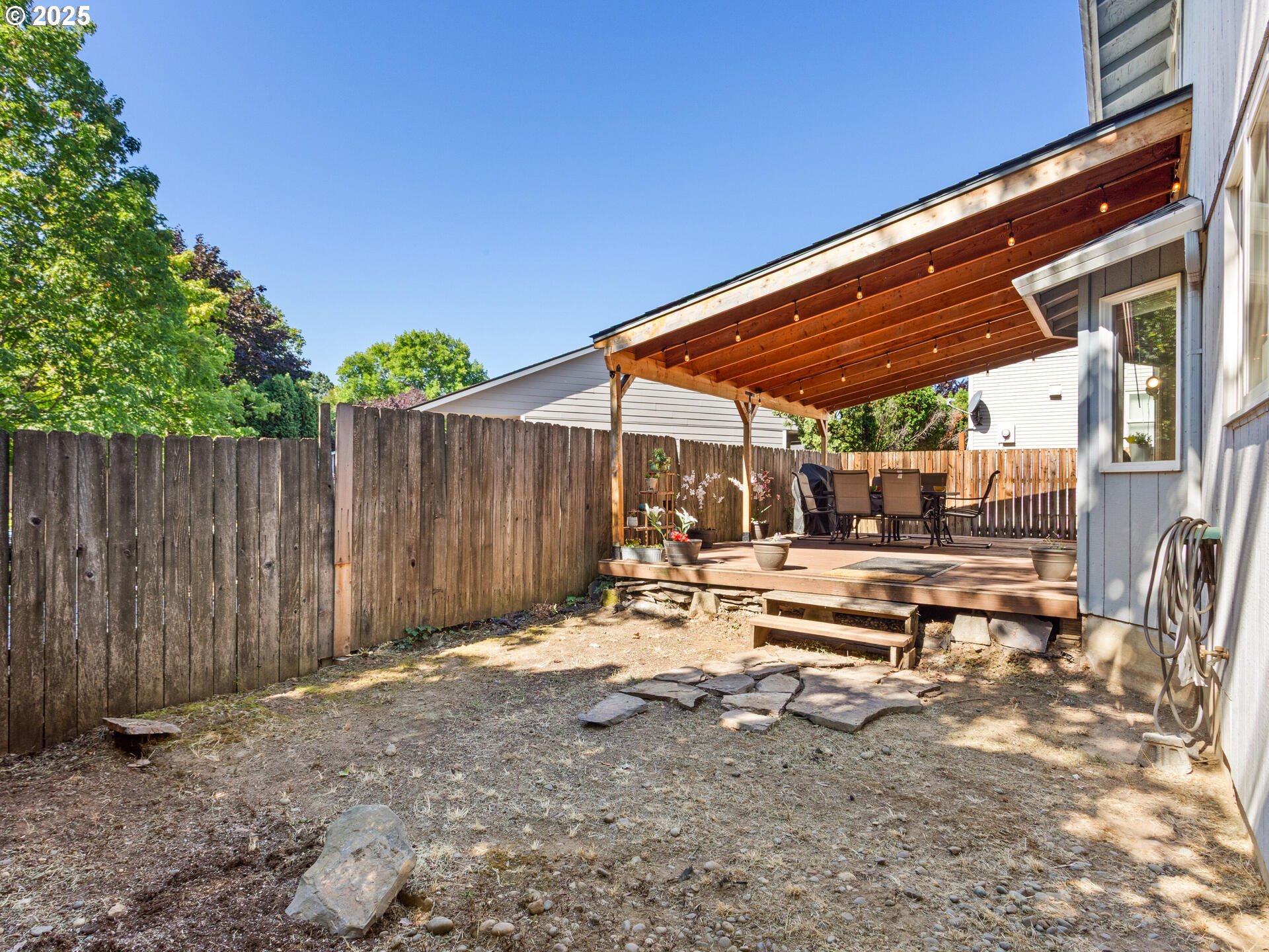 8292 Northeast Snowberry Loop Vancouver, WA 98664 - Photo 47 of 48 a view of a backyard with chairs