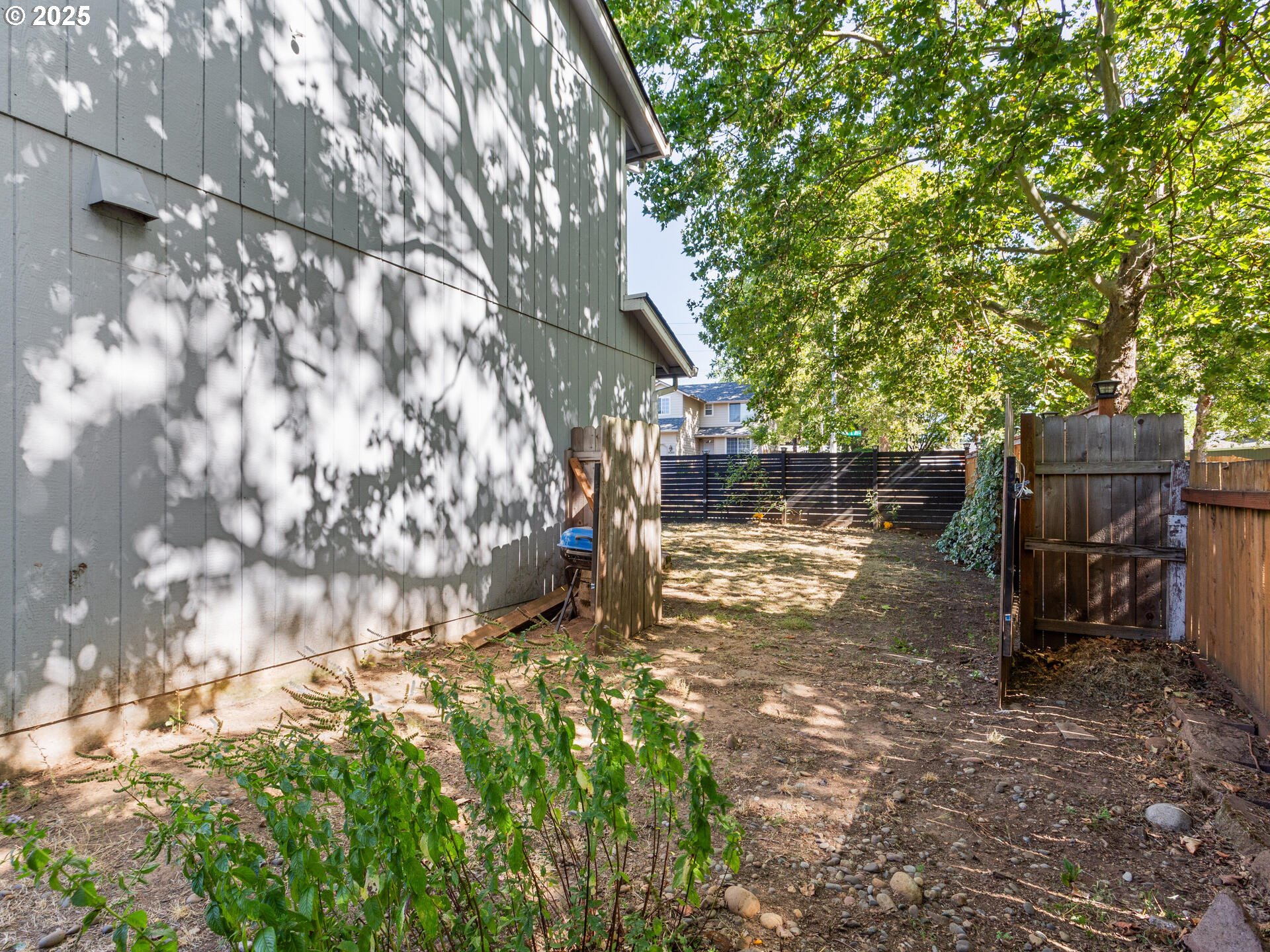 8292 Northeast Snowberry Loop Vancouver, WA 98664 - Photo 48 of 48 a backyard of a house with lots of green space