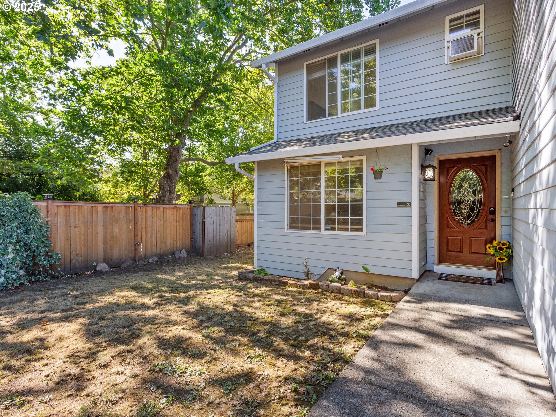 8292 Northeast Snowberry Loop Vancouver, WA 98664 - Photo 7 of 48 a view of house with backyard and wooden fence