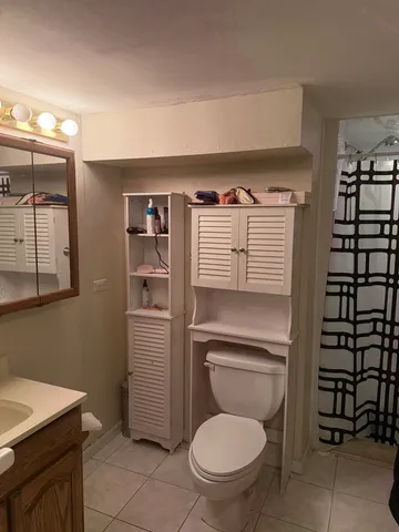 a view of a dining room with furniture and a chandelier