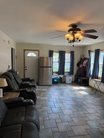a living room with furniture and a fireplace