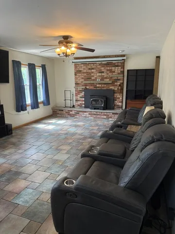a bedroom with a bed couch and window