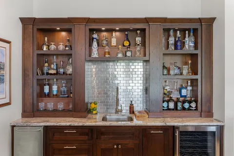 a kitchen with cabinets and window