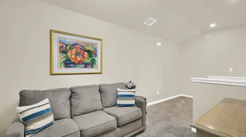 a living room with furniture and a couch