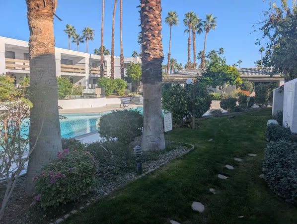a view of a yard with cars