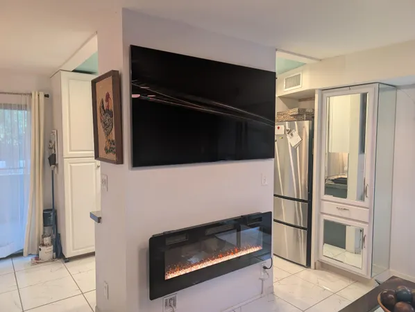 a kitchen with a refrigerator and a sink