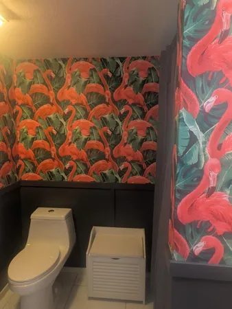 a bathroom with a sink mirror and vanity