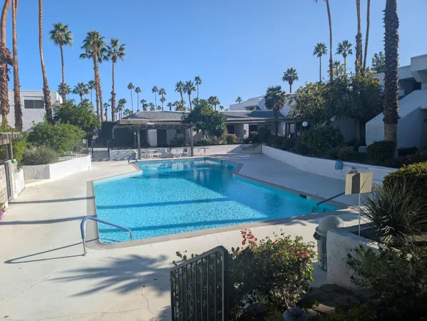 a view of a swimming pool with a patio