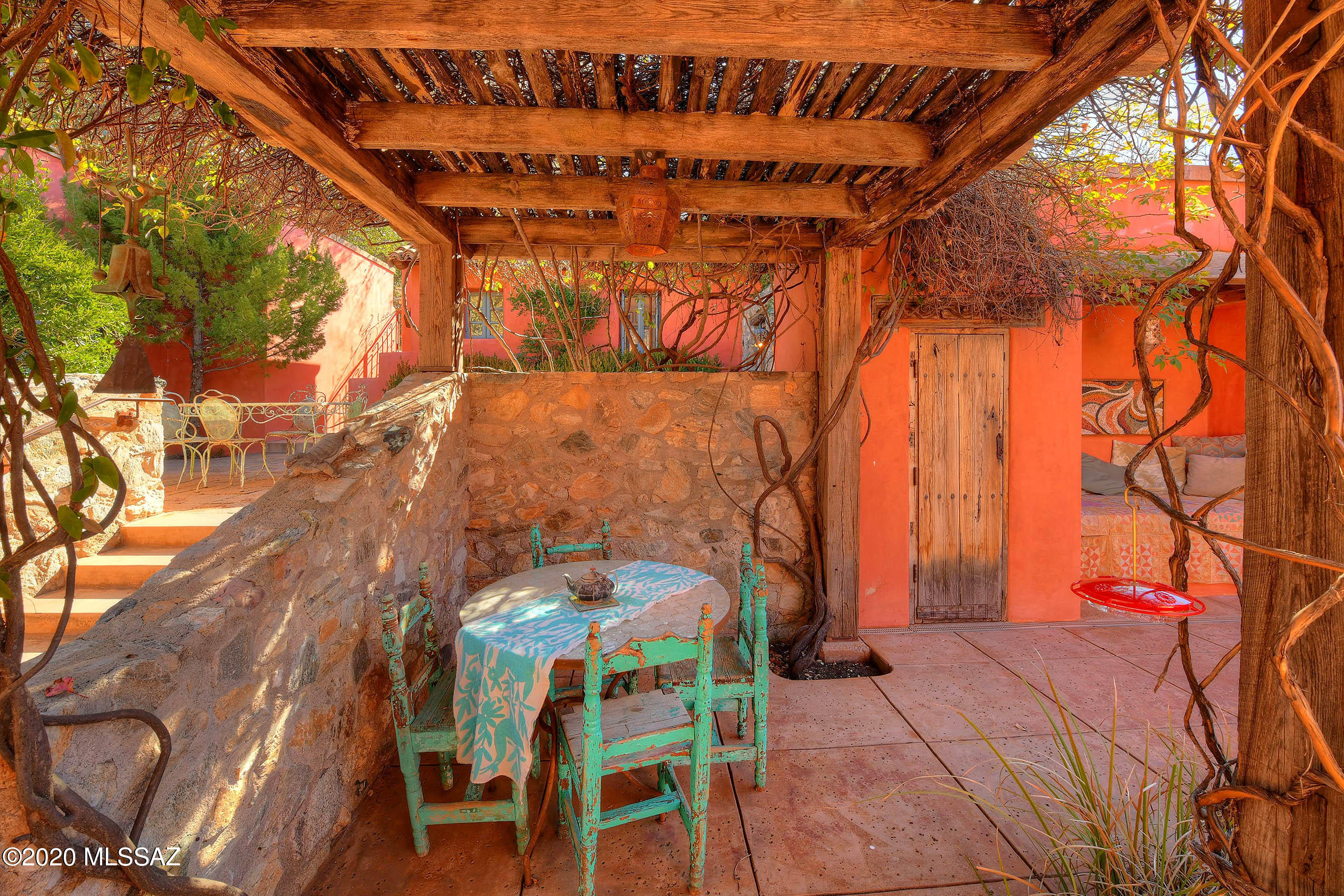 360 Harshaw Creek Road Patagonia, AZ 85624 - Photo 12 of 50 a backyard of a house with table and chairs