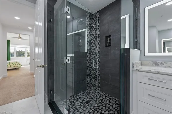 a bathroom with a shower and a sink