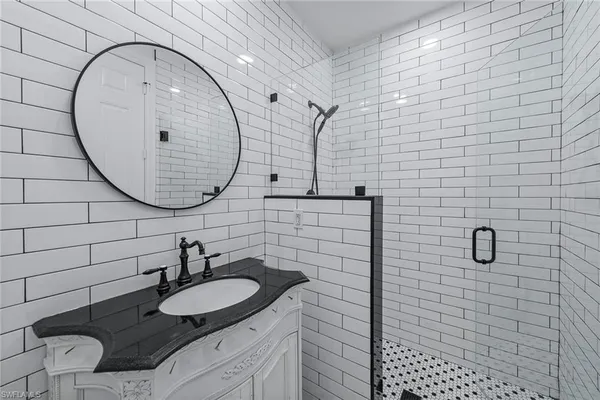 a bathroom with a sink and a mirror