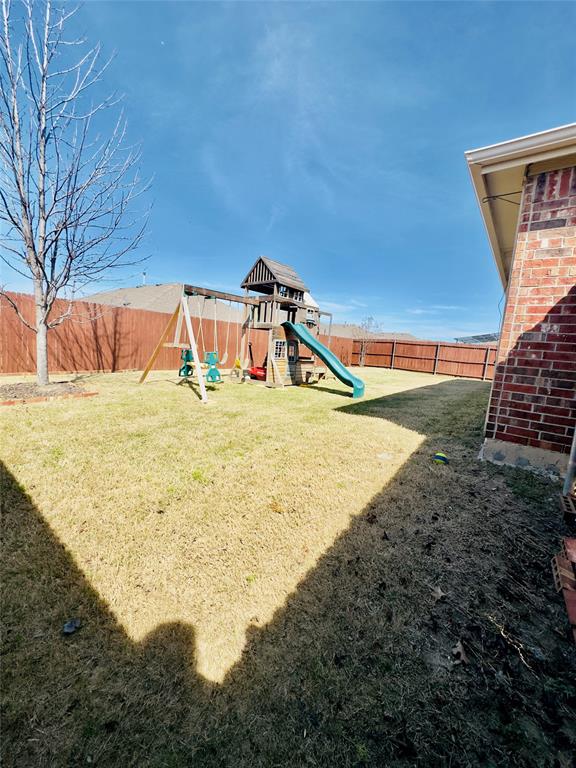 1508 Wild Rye Circle Princeton, TX 75407 - Photo 13 of 17 View of jungle gym with a fenced backyard