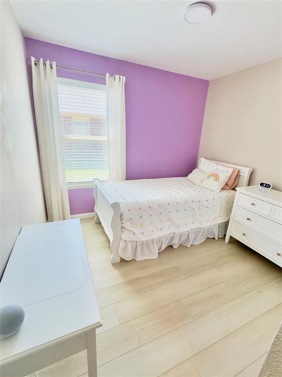 1508 Wild Rye Circle Princeton, TX 75407 - Photo 3 of 17 Bedroom featuring light wood-type flooring