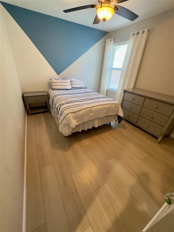 1508 Wild Rye Circle Princeton, TX 75407 - Photo 10 of 17 Bedroom with light wood-type flooring and a ceiling fan