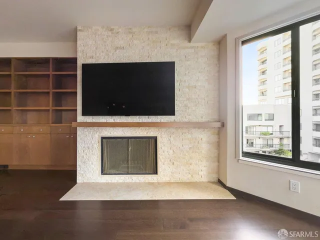 a view of an empty room with a window