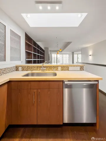 a kitchen with stainless steel appliances granite countertop a stove and a refrigerator