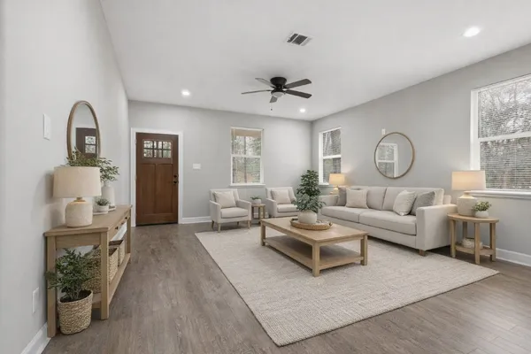 a living room with furniture and a large window