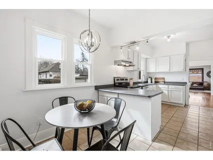 a kitchen with cabinets and a sink