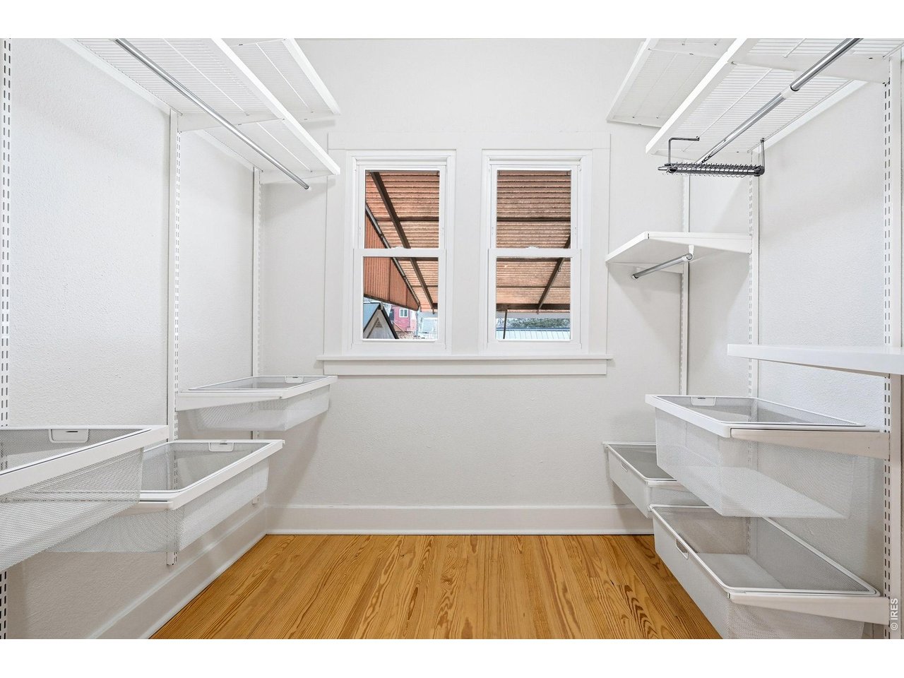 3740 Grove Street Denver, CO 80211 - Photo 19 of 40 Primary bedroom walk-in closet. Yes, a turn-of-the-century bungalow has walk in closets for each bedroom!