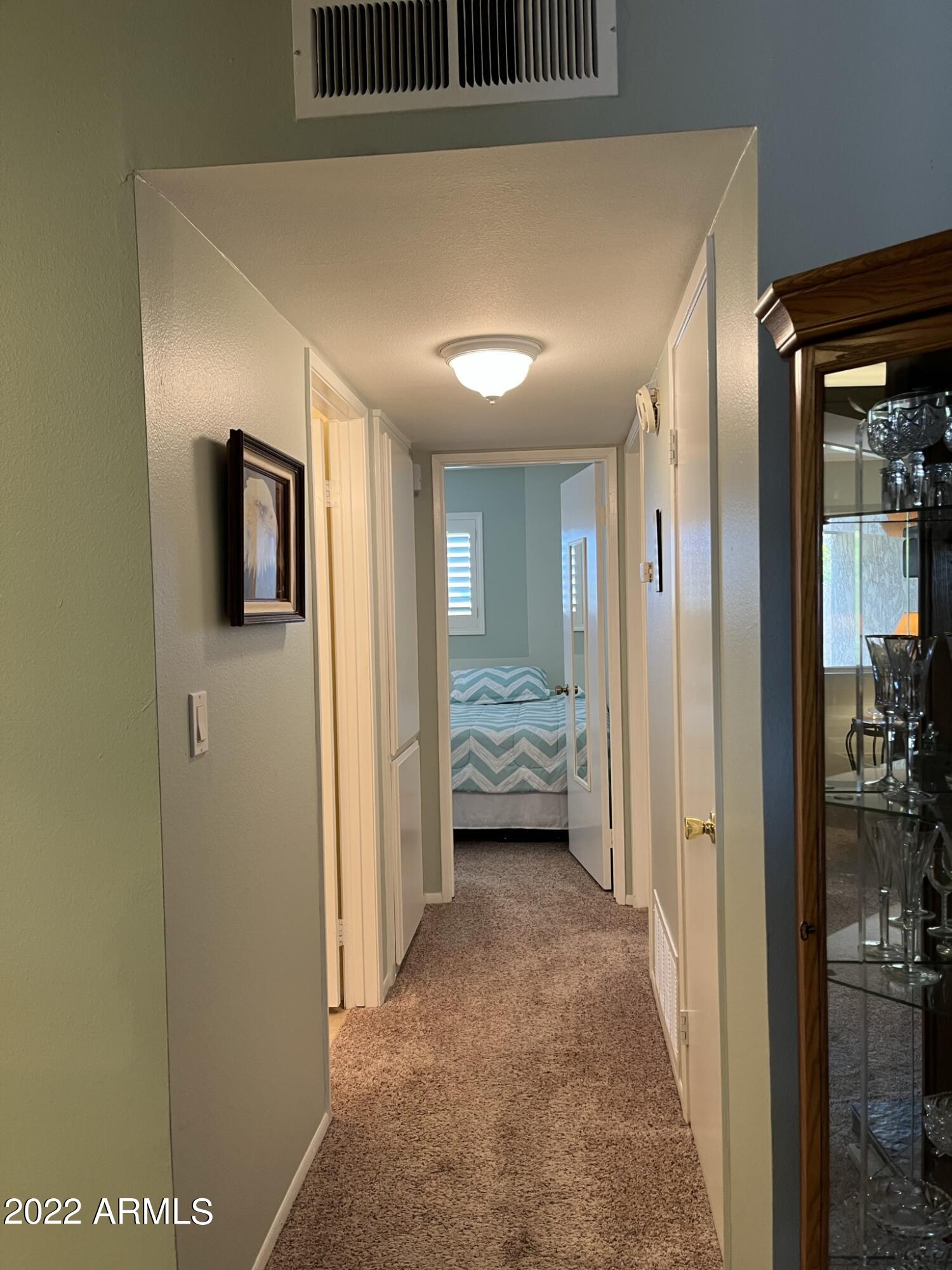 5525 East Thomas Road, Unit A11 Phoenix, AZ 85018 - Photo 16 of 22 Hallway to Guest Bedroom
