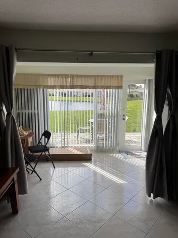 a living room with a couch and a large window