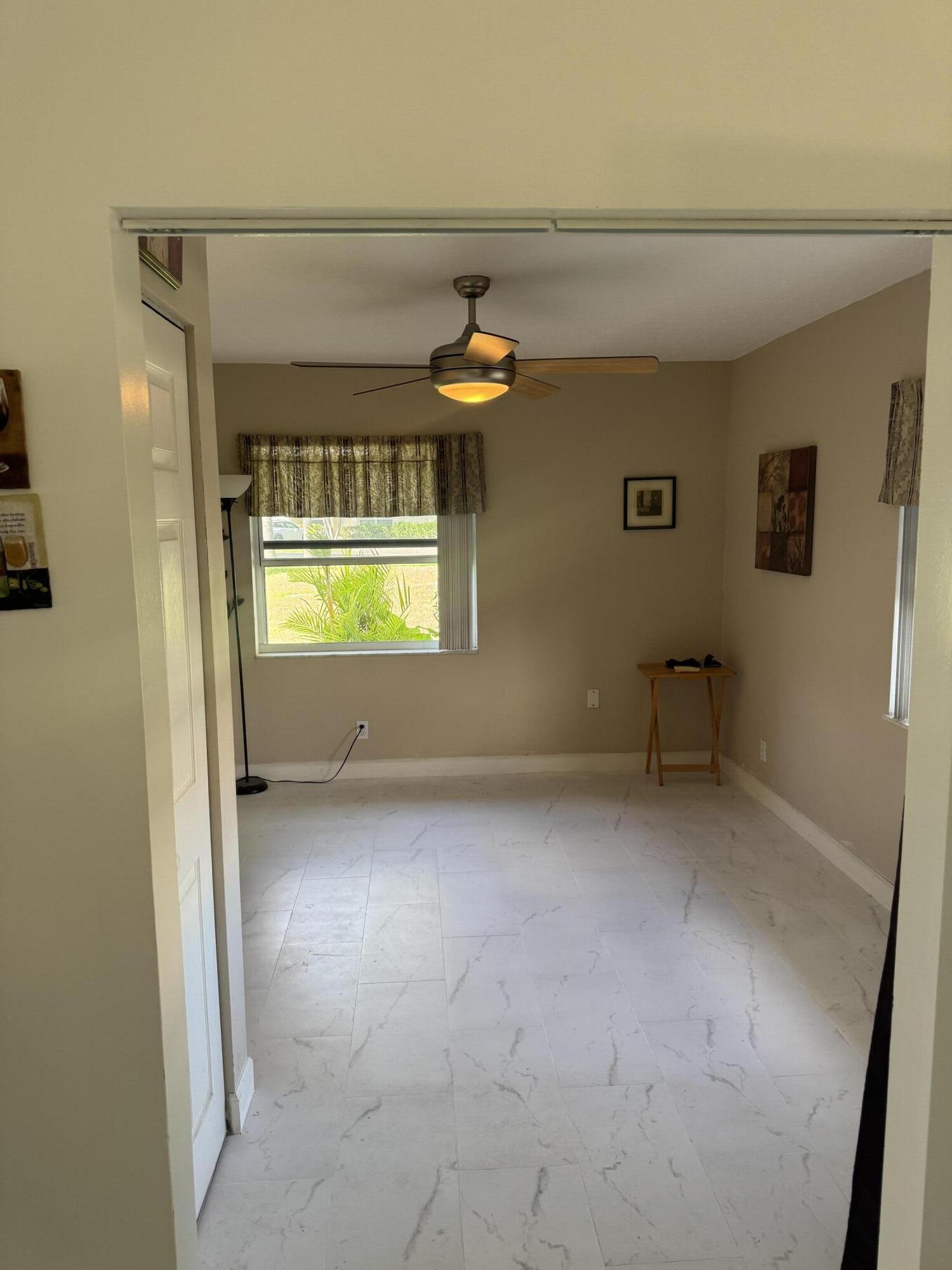 8892 Bella Vista Drive, Unit 333 Boca Raton, FL 33433 - Photo 2 of 18 a view of an empty room and window