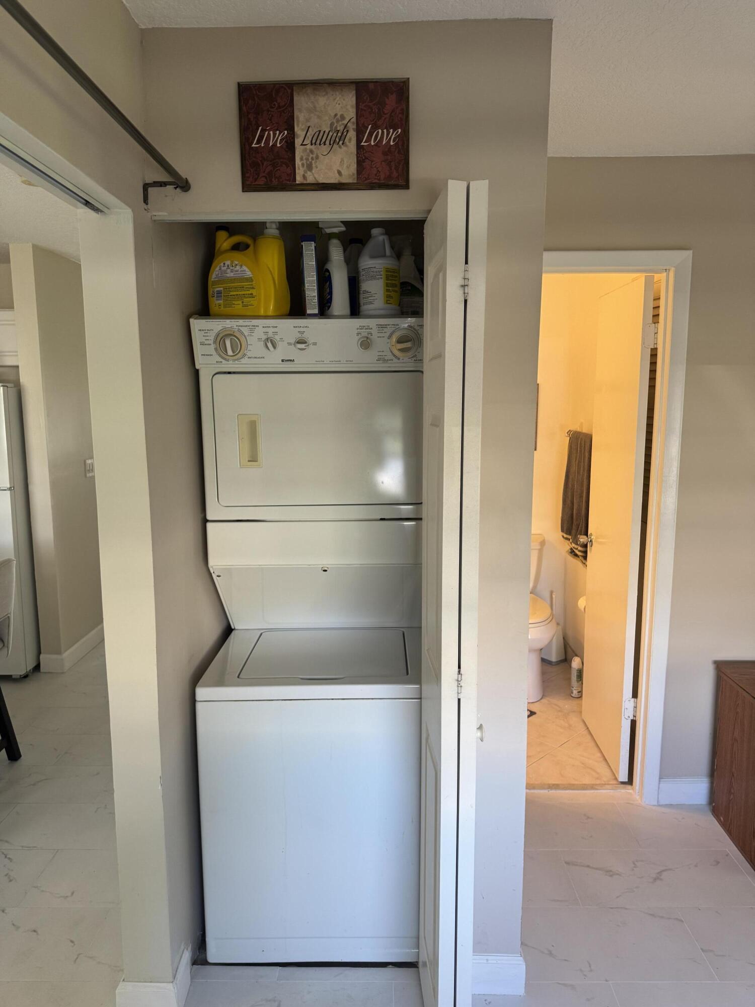 8892 Bella Vista Drive, Unit 333 Boca Raton, FL 33433 - Photo 4 of 18 a utility room with a washer and dryer