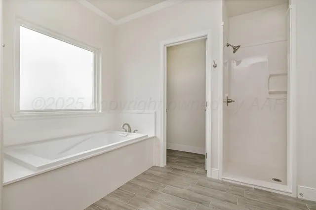 a white bath tub sitting next to a shower