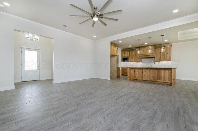 a view of a kitchen with a sink and a window
