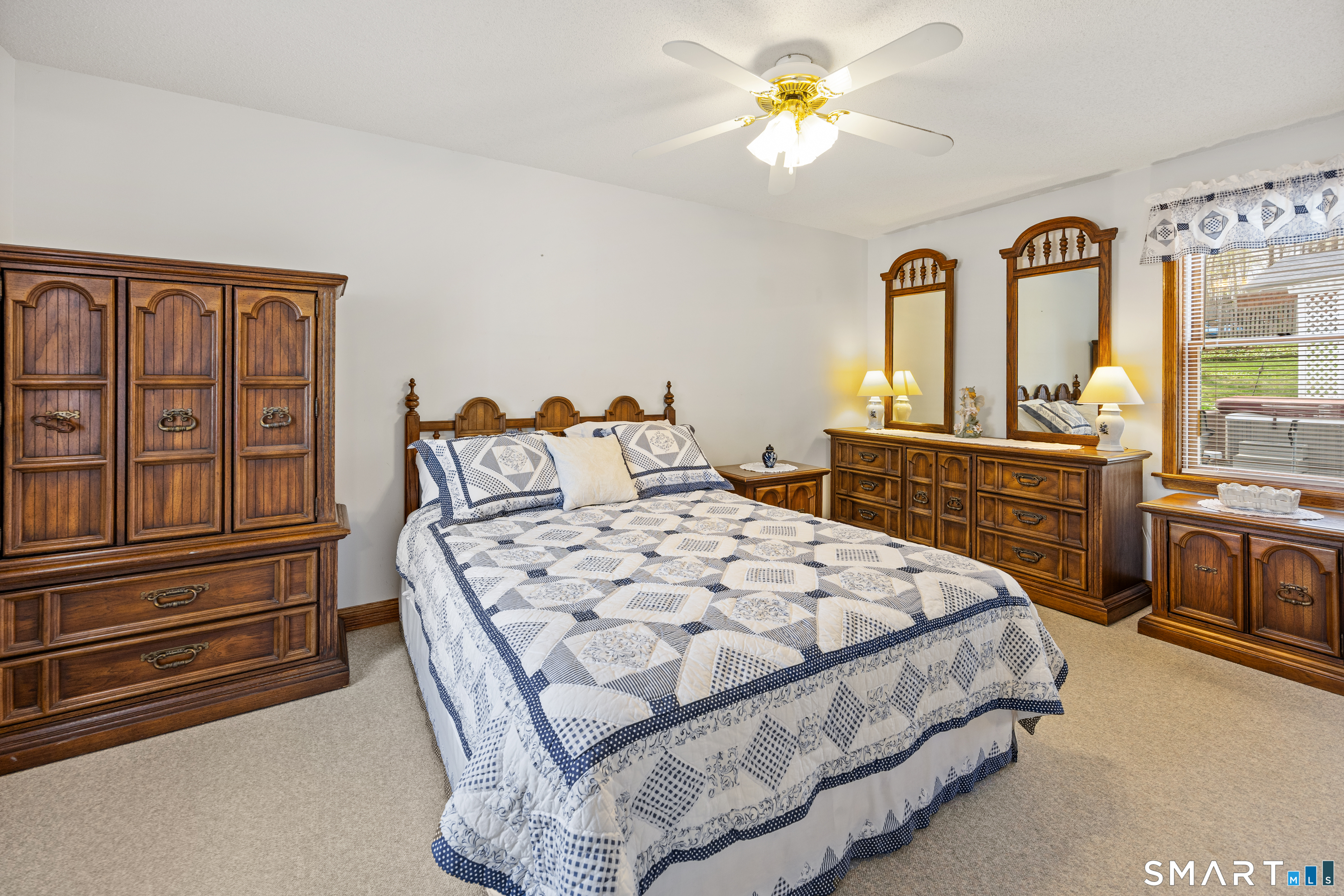 42 Chimney Sweep Road Wallingford, CT 06492 - Photo 37 of 40 a bedroom with a bed dresser and a window