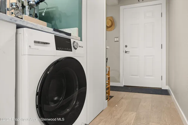 a view of a storage & utility room with a washer and dryer