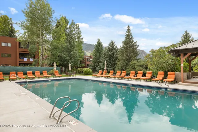 a view of swimming pool with a lake view