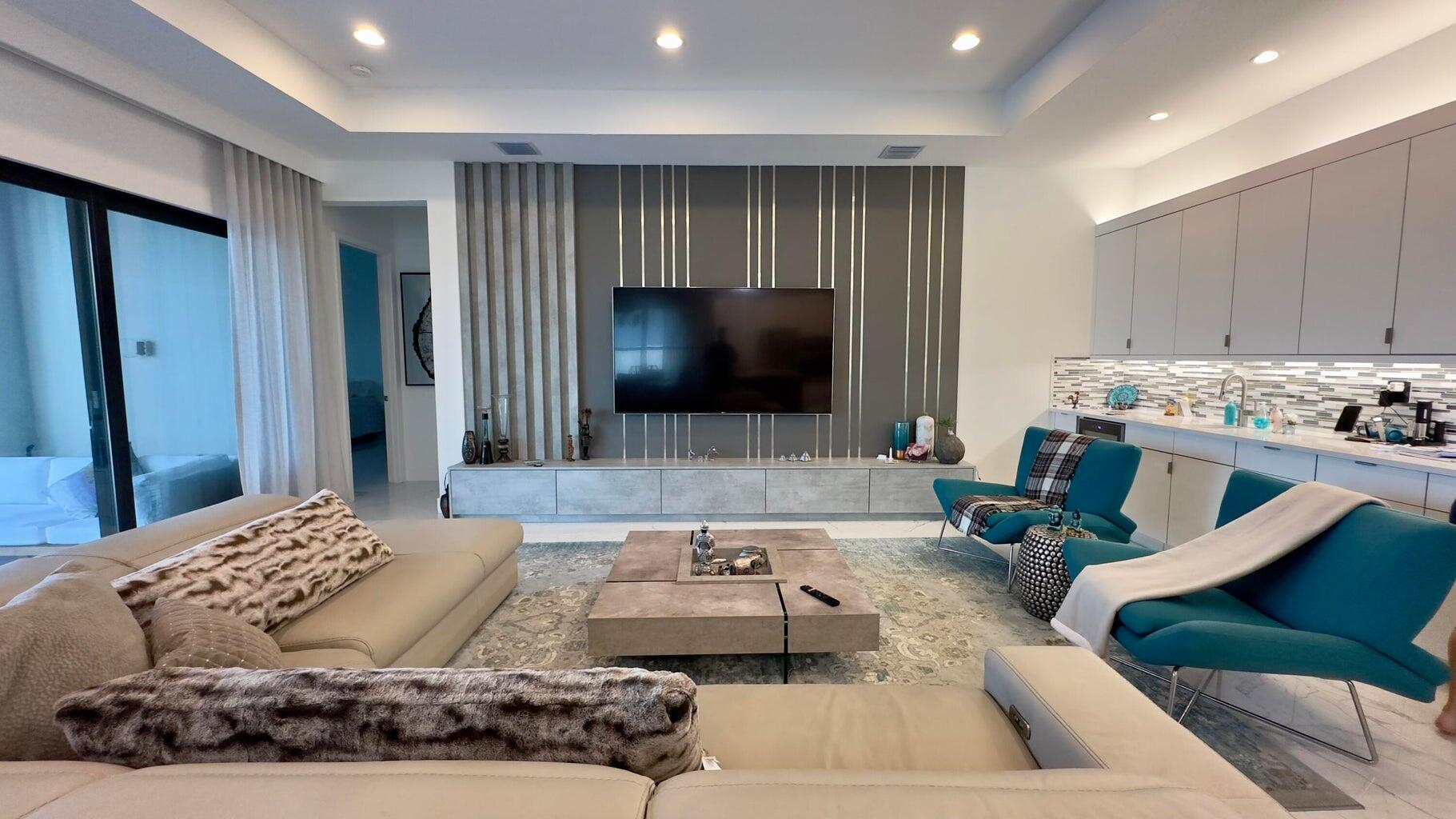 8817 New River Falls Road Boca Raton, FL 33496 - Photo 15 of 54 a living room with furniture and a flat screen tv