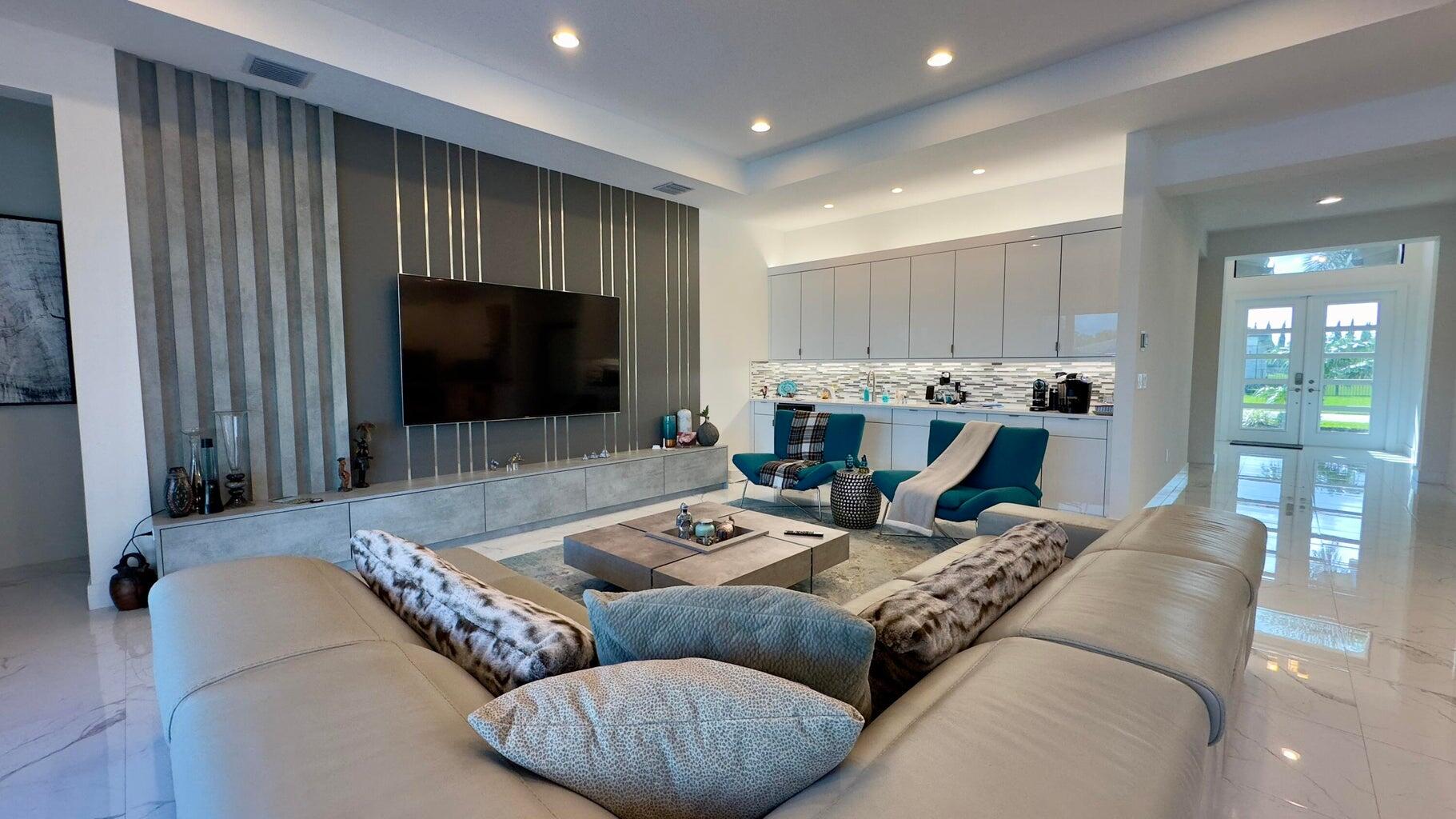 8817 New River Falls Road Boca Raton, FL 33496 - Photo 17 of 54 a living room with furniture and a flat screen tv