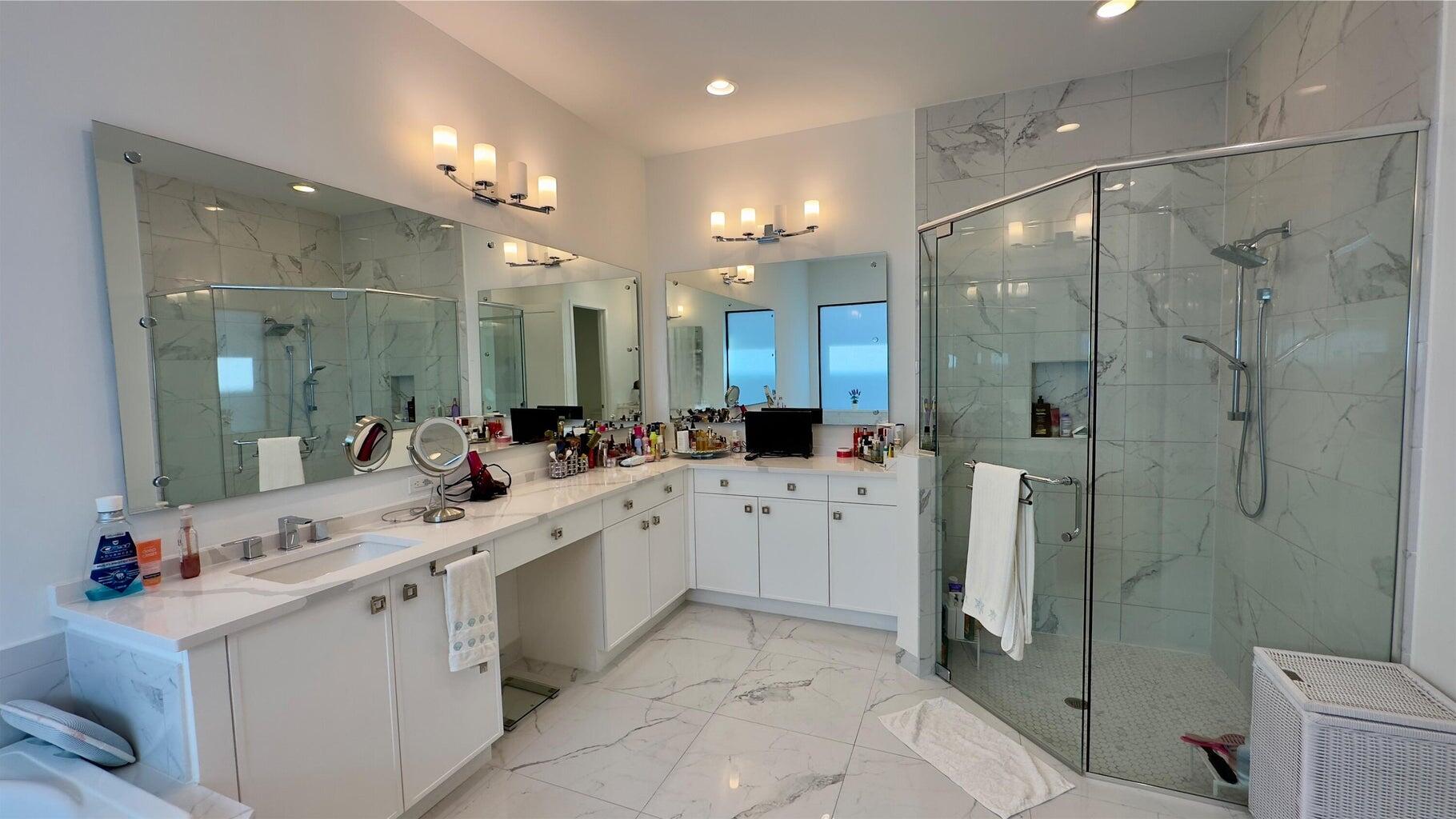 8817 New River Falls Road Boca Raton, FL 33496 - Photo 27 of 54 a large bathroom with a shower sink mirror and toilet