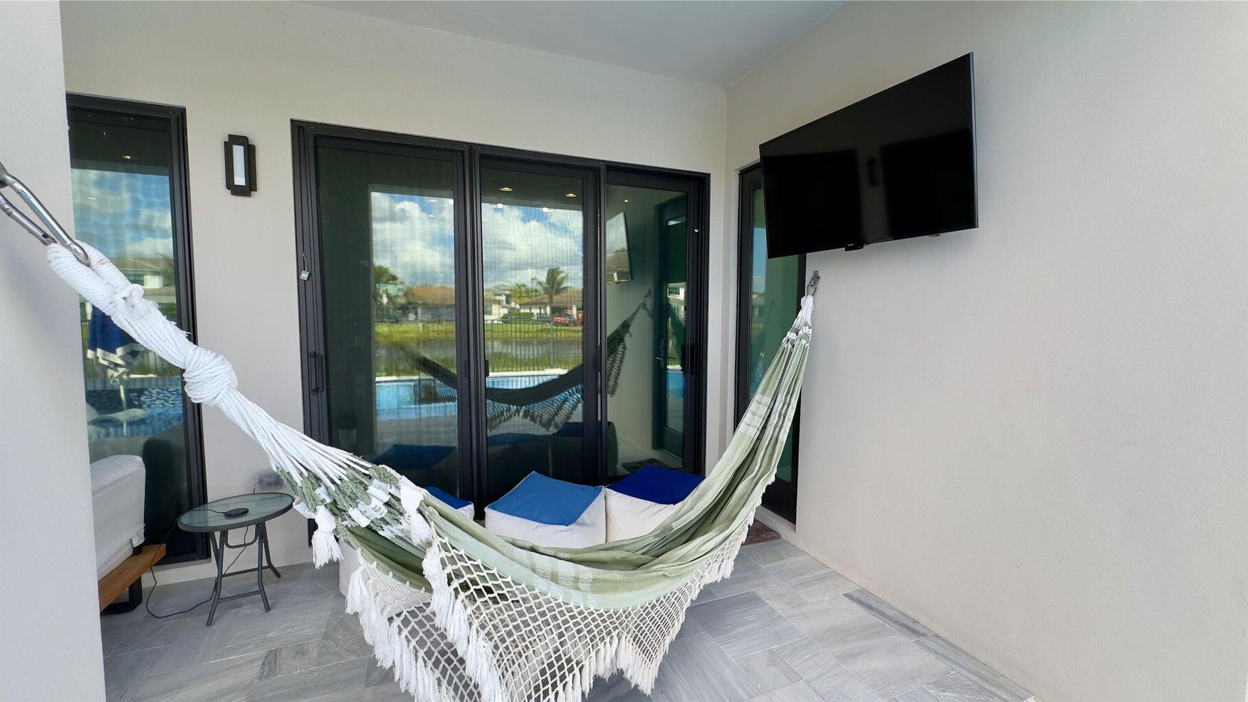 8817 New River Falls Road Boca Raton, FL 33496 - Photo 30 of 54 a living room with furniture and a flat screen tv