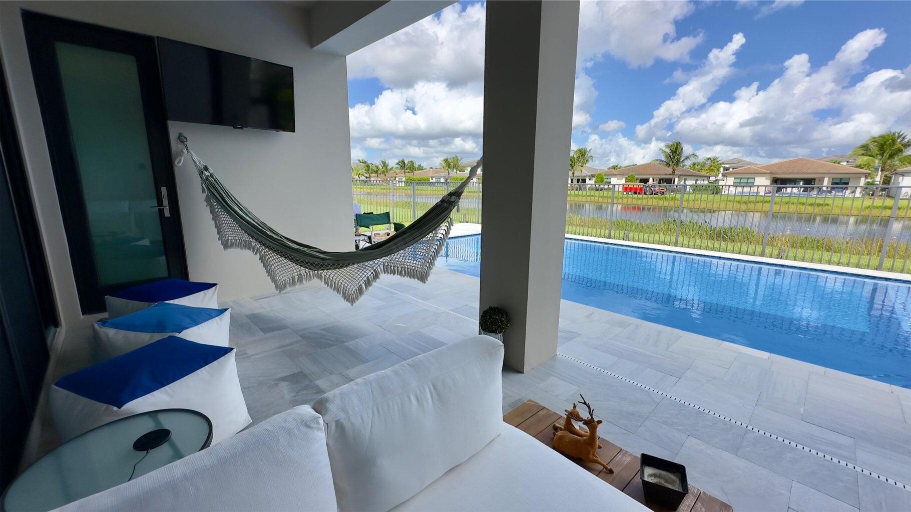 8817 New River Falls Road Boca Raton, FL 33496 - Photo 31 of 54 a view of swimming pool from a window