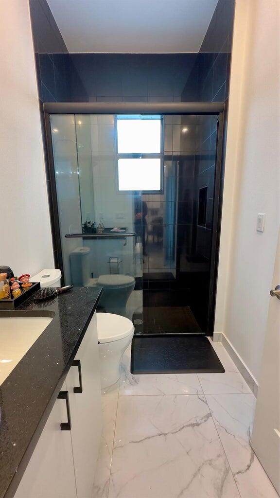 8817 New River Falls Road Boca Raton, FL 33496 - Photo 40 of 54 a bathroom with a sink and a mirror