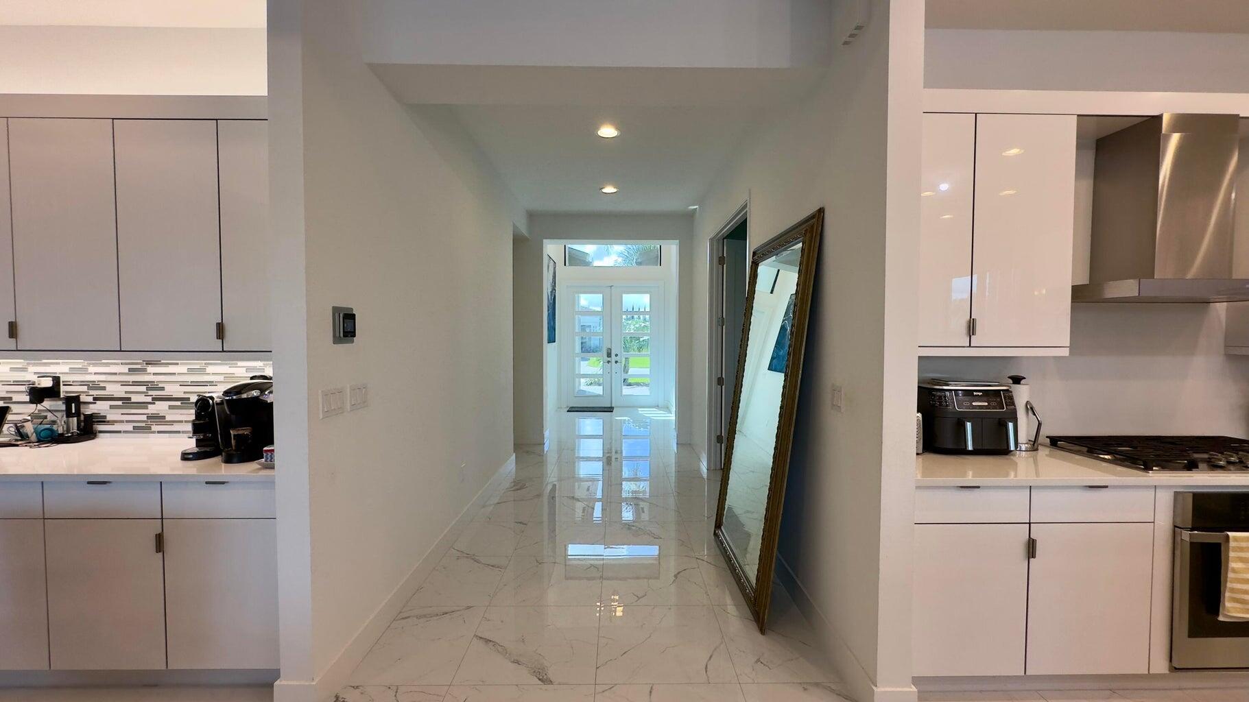 8817 New River Falls Road Boca Raton, FL 33496 - Photo 7 of 54 a kitchen with a sink and refrigerator