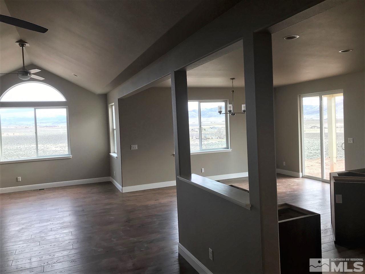 277 Bootstrap Lane Reno, NV 89510 - Photo 7 of 22 a view of hallway with window and wooden floor