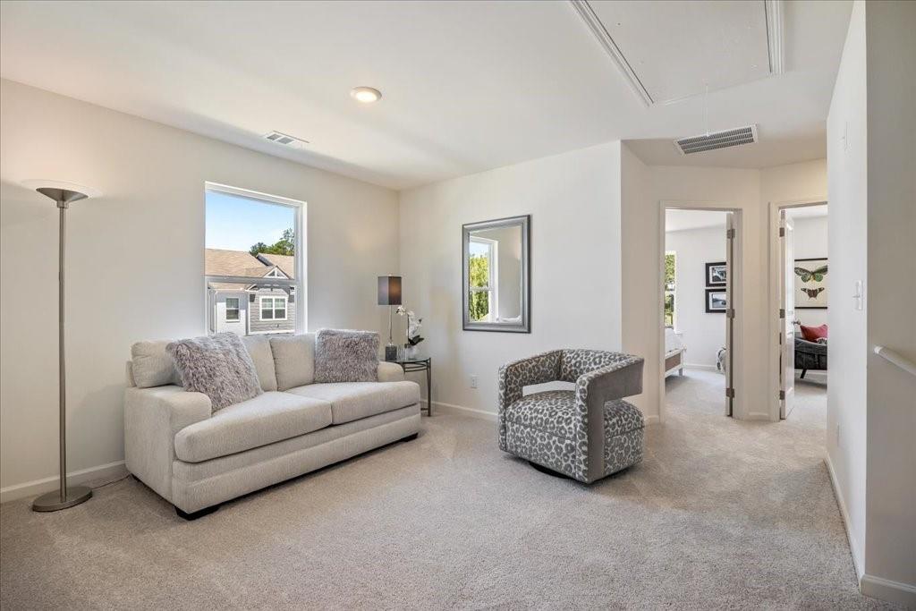 a living room with furniture and a window