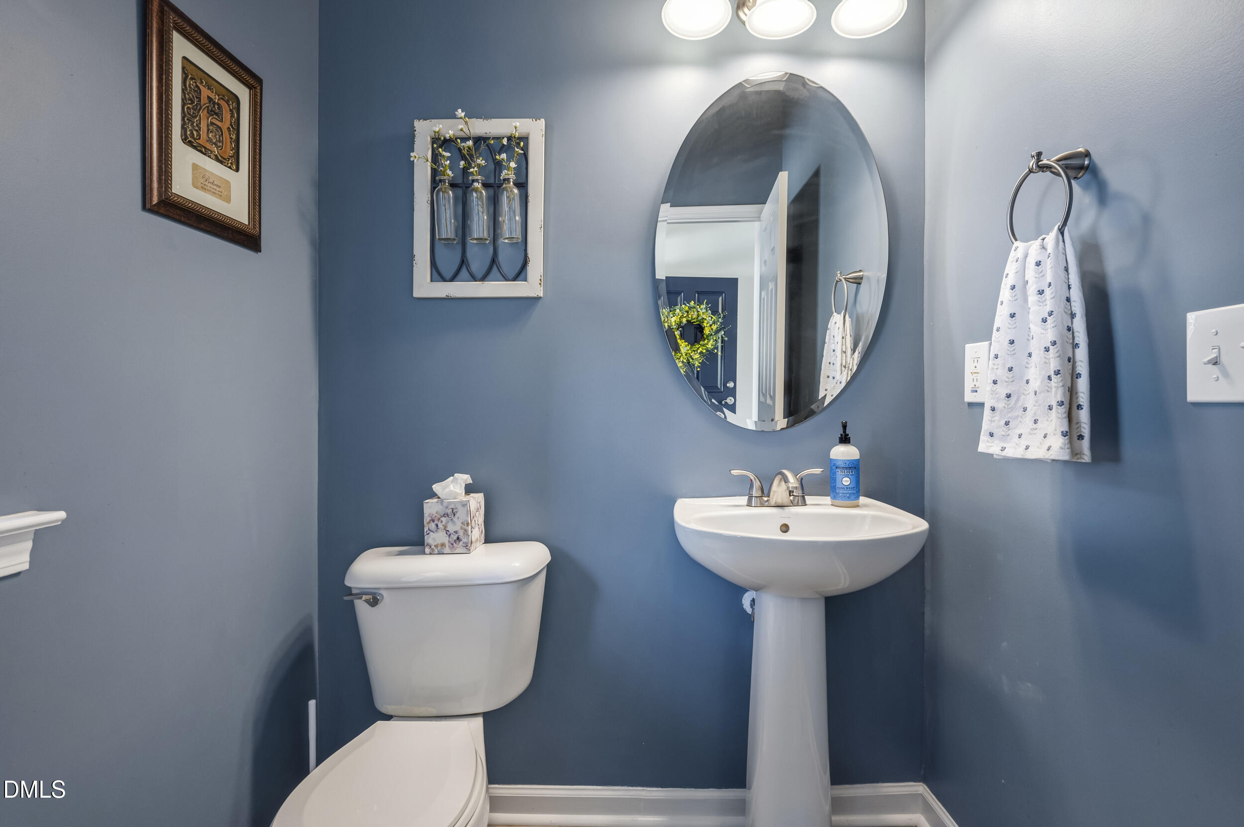 112 Ryder Cup Circle Raleigh, NC 27603 - Photo 17 of 45 a bathroom with a sink and a mirror