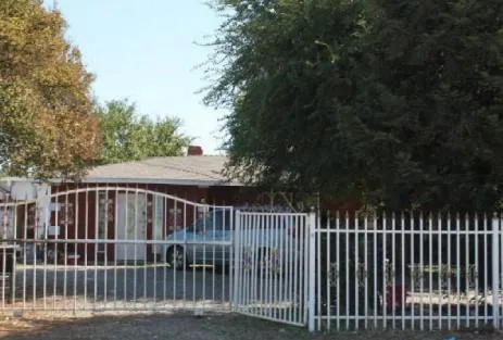 a view of deck with white fence and trees