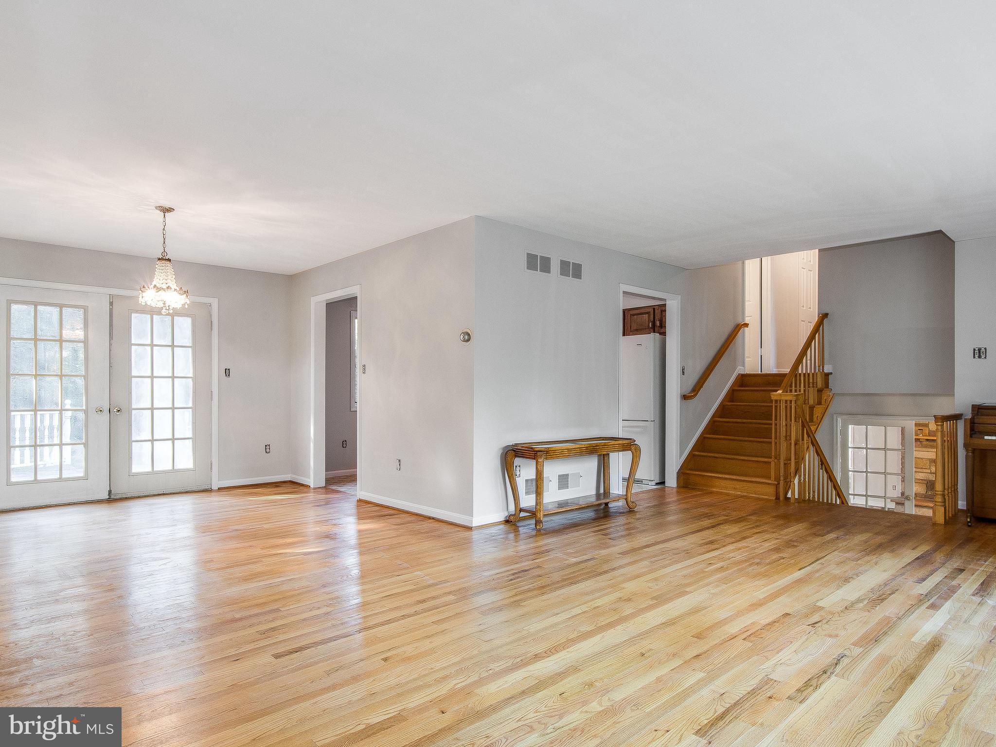 3820 Nicholson Road Westminster, MD 21157 - Photo 6 of 25 living room opens to dining room and deck
