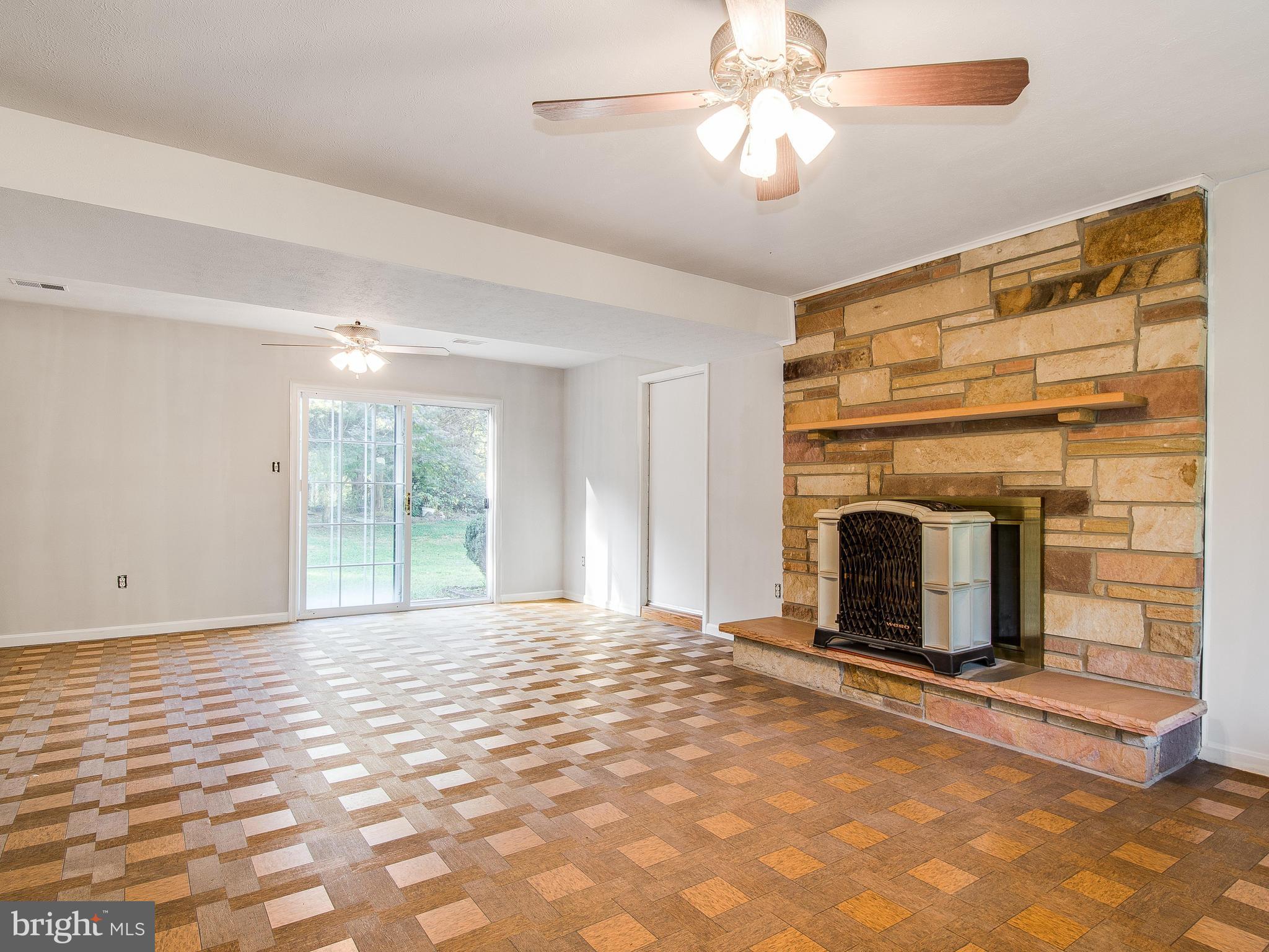 3820 Nicholson Road Westminster, MD 21157 - Photo 9 of 25 huge family room with stone fireplace and walk-out