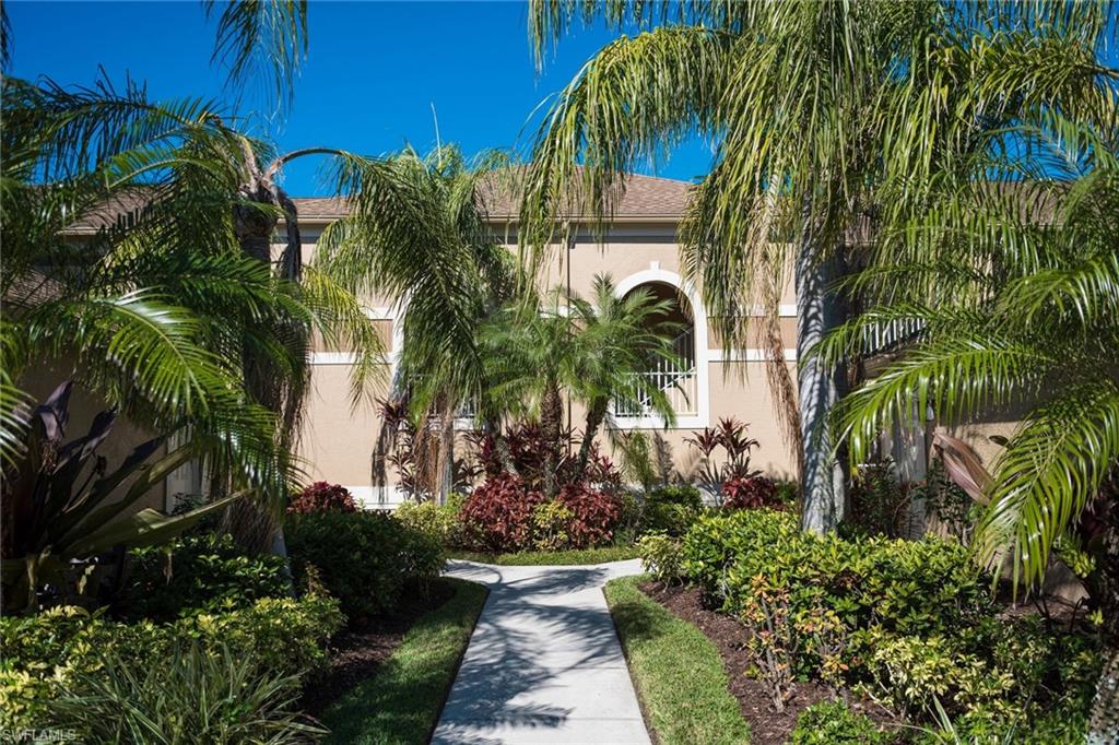 7635 Arbor Lake Court, Unit 2423 Naples, FL 34112 - Photo 22 of 35 a view of a palm plant that is sitting in front of house