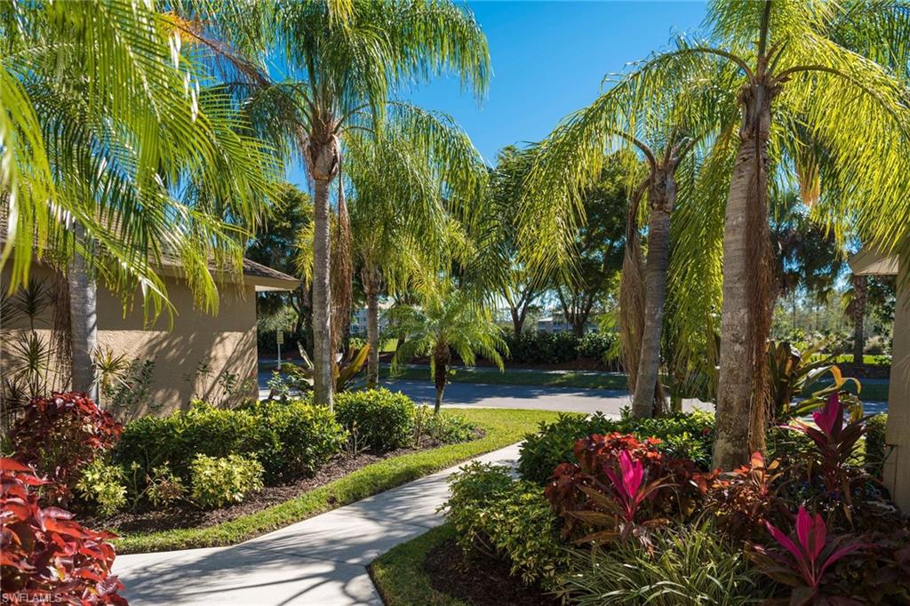 7635 Arbor Lake Court, Unit 2423 Naples, FL 34112 - Photo 24 of 35 a view of a flower in a yard